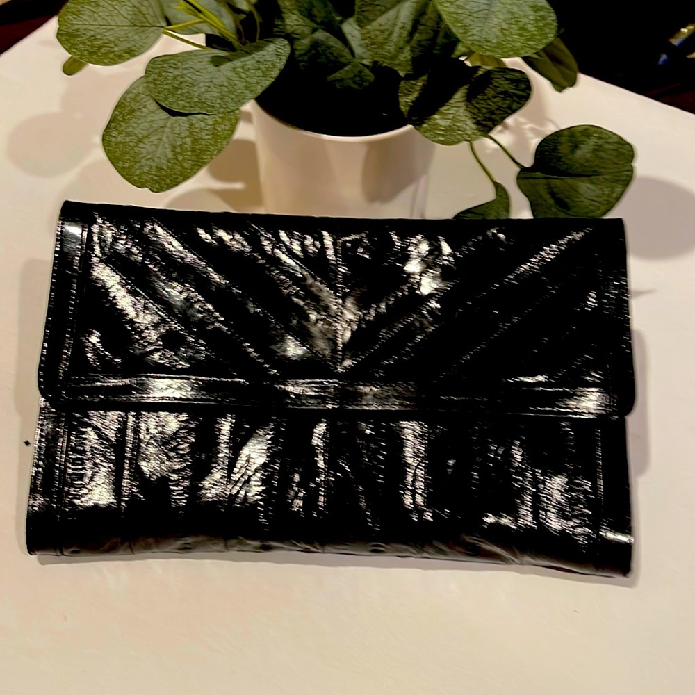 Black genuine, eel skin clutch with five pockets